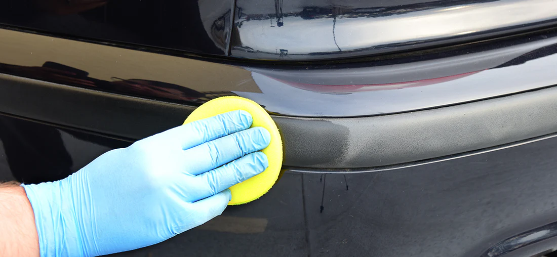 Close detail work on vehicle trim during a detailing appointment